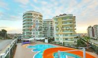 AL-1881, Меблированная квартира 1+1 (54 м²) на 1-м этаже с крытым и открытым бассейнами, сауной и тренажерным залом, в 250 м от моря — Авсаллар