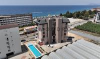 AL-2212, В 50 м от моря — дуплекс площадью 100 м² на верхнем этаже, планировка 2+1, с балконами с видом на море, бассейном, сауной и парной, Каргиджак